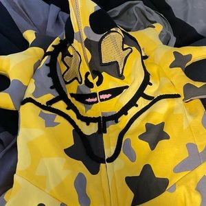 Yellow full zip up hoodie.